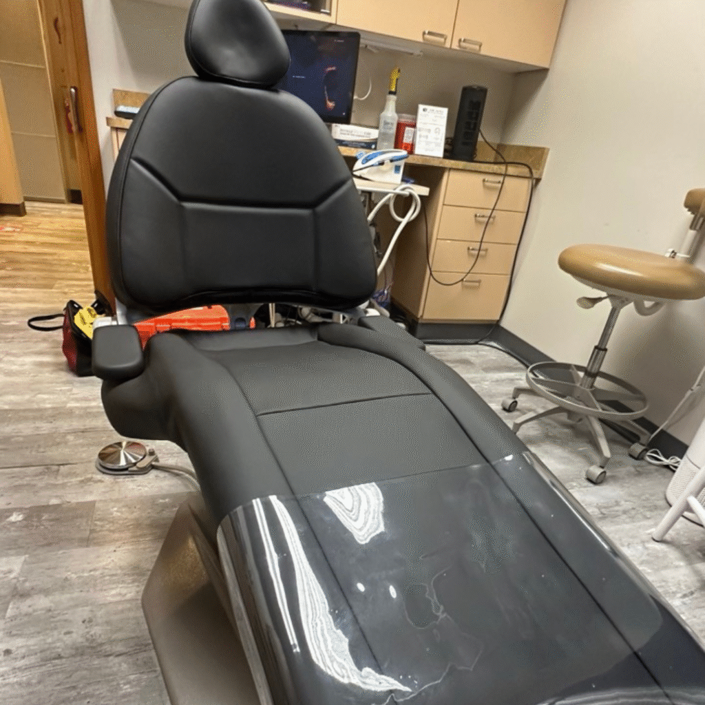 Dental chair with fresh black upholstery, restored like new