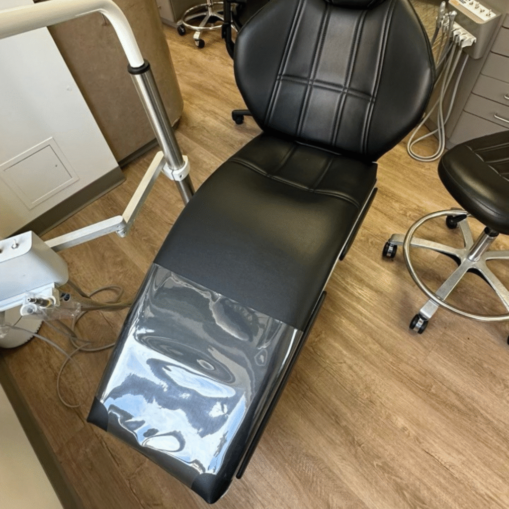 Cosmetic treatment chair reupholstered with premium black leatherette
